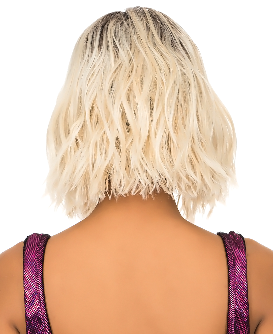 Back view of New Born Free CUTIE Wig 172. Rooted dark to platinum blonde, wavy, short bob style.