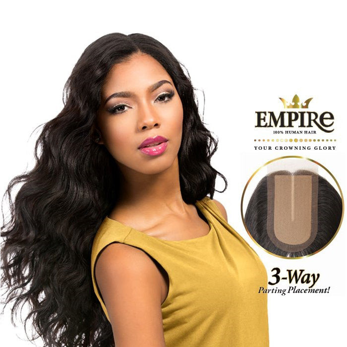 Woman wears long, black HH CLOSURE-BODY WAVE 12 (EMPIRE) hair, styled with a middle part and body waves. Includes closure ...