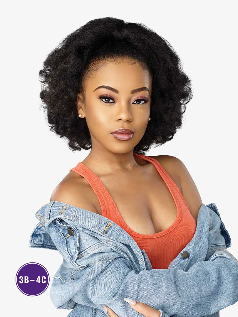 A woman wearing the Curls Kinks & Co RAIN MAKER Textured Drawstring Ponytail. It's a voluminous, natural black, kinky-curl...