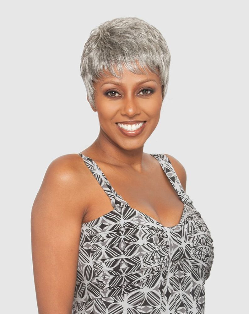 Smiling woman wears the Vanessa DEO Quick & Easy wig, a short, textured salt & pepper gray pixie cut.