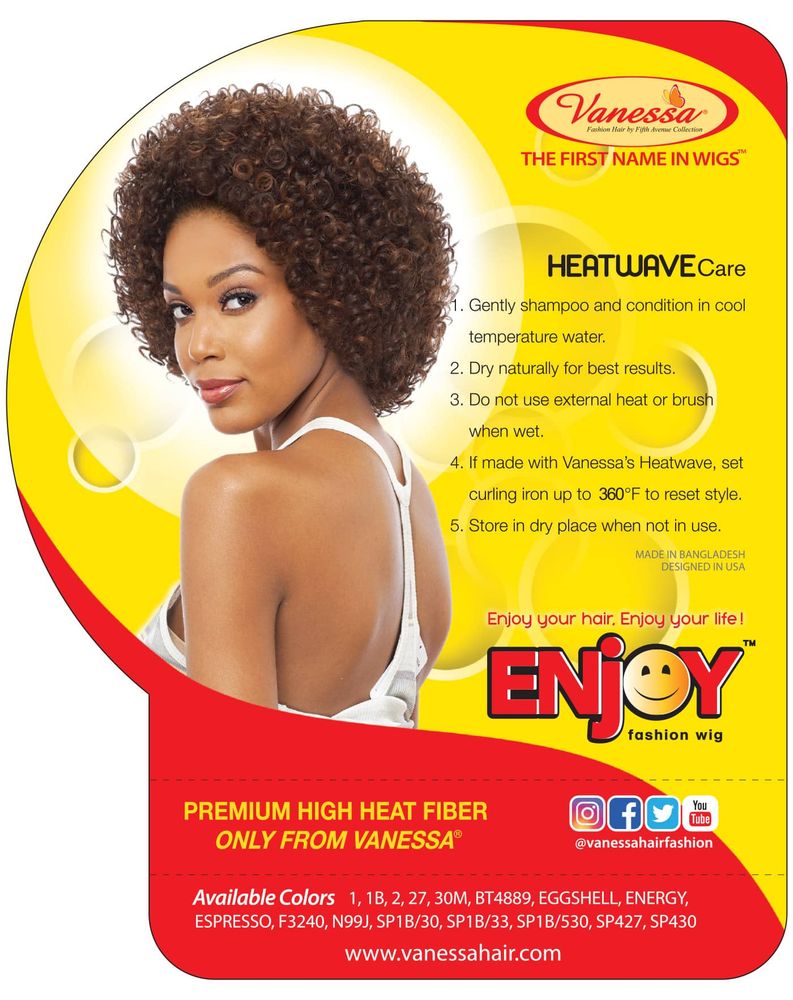 A woman models the Vanessa Half Wig JOY ATIO. She has short, bouncy, deep curly hair in a rich auburn blend.