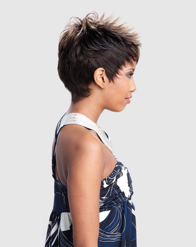 A woman models the Vanessa MOBY Synthetic Wig, a short, spiky pixie cut in dark brown with blonde highlights.