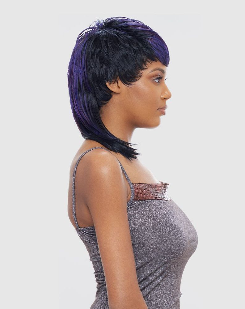 Vanessa MOXIE Synthetic Wig shown on woman. Short, layered black wig with bold purple highlights, styled with a chic, text...