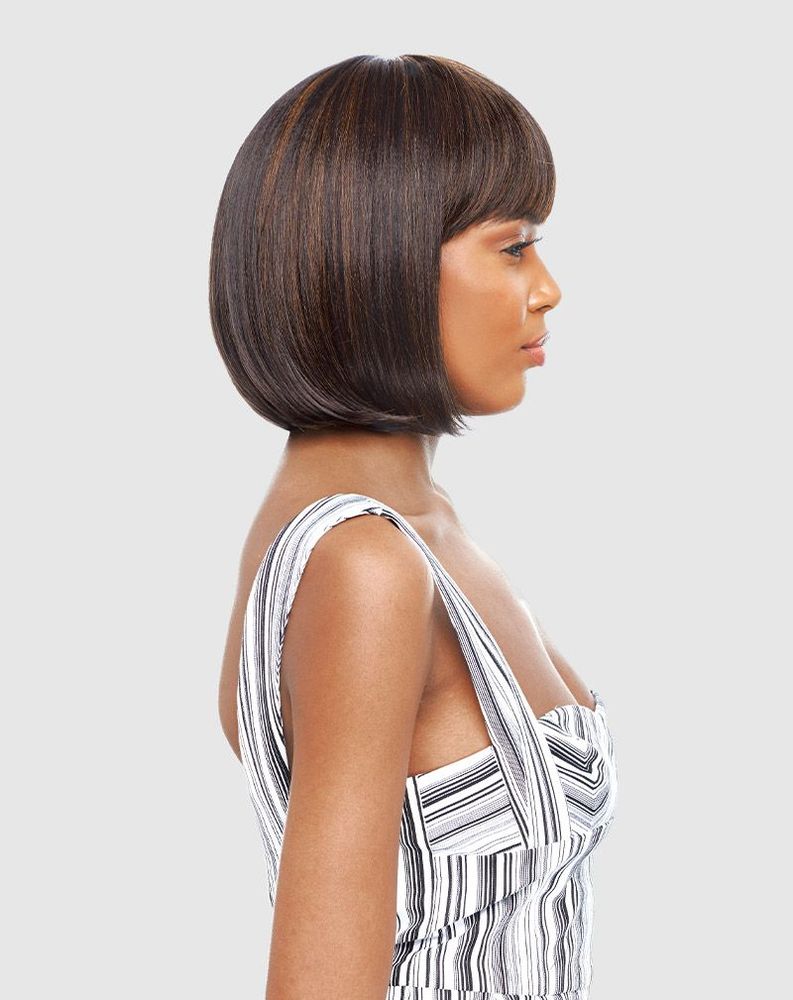 Woman models Vanessa SMART FLORA Synthetic Wig. She wears a sleek, chin-length bob with bangs, dark brown with highlights.
