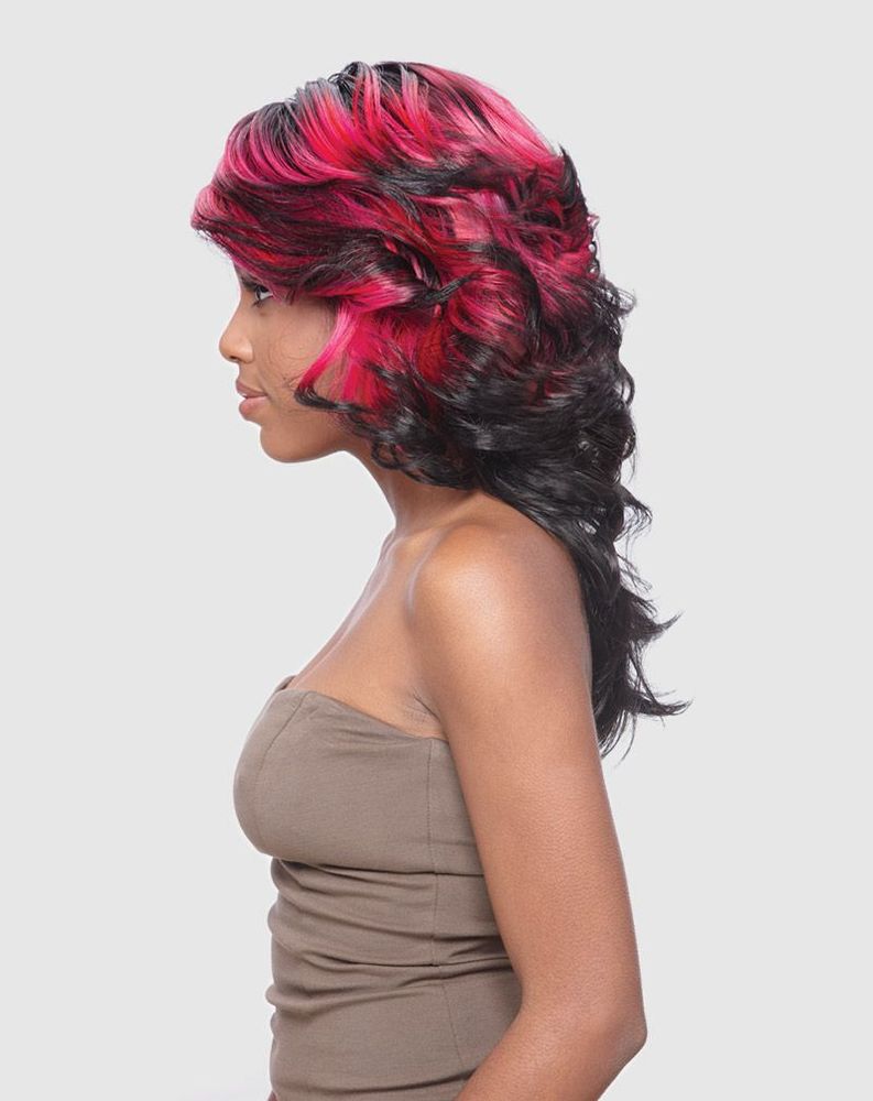 Woman wears Vanessa SUPER STENA wig: voluminous, wavy black hair with vibrant pink highlights, medium-long.