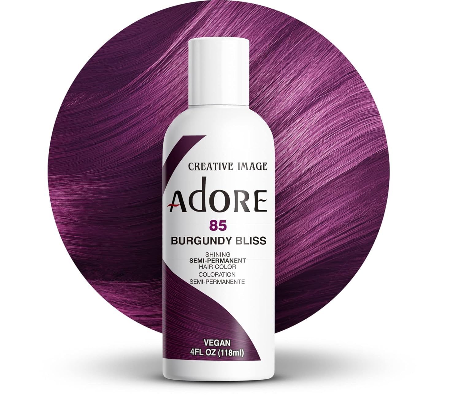 Creative Image Adore #85 Burgundy Bliss hair color bottle in front of a circular swatch of vibrant, sleek burgundy hair.