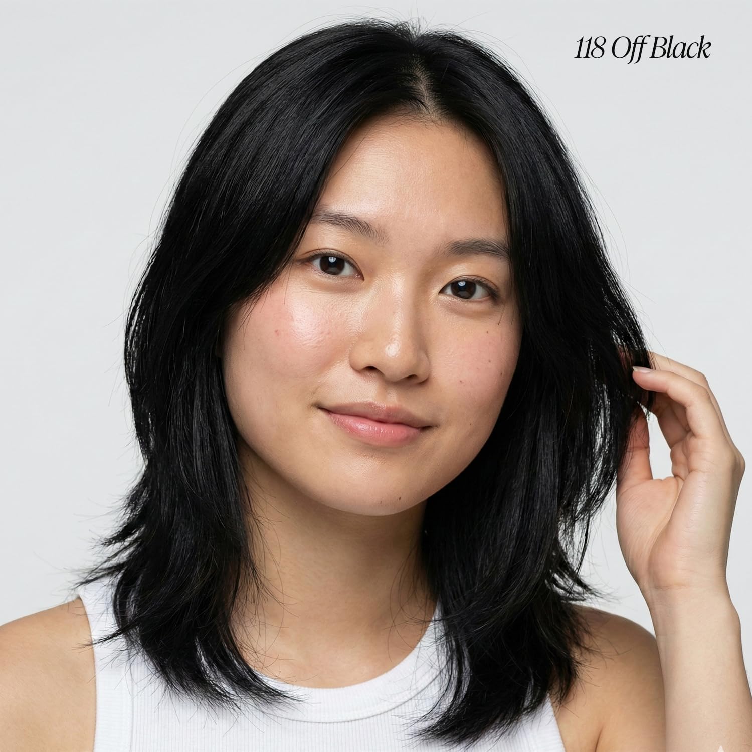 Young woman with layered, medium-length Creative Image Adore #118 Off Black hair color.