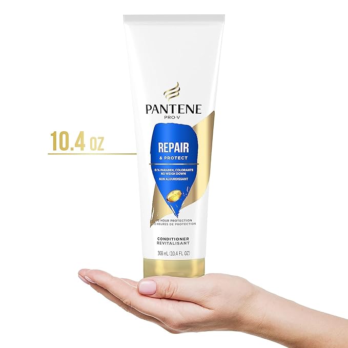 A hand holds a 10.4 oz tube of Pantene Pro-V Repair & Protect Conditioner with a white, blue, and gold design.