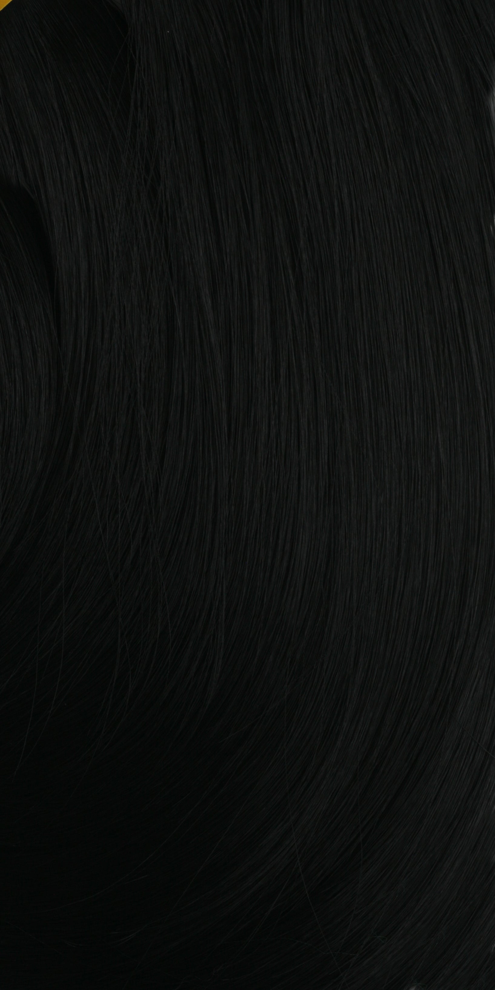 Close-up of HR DEEP BULK 18" FREETRESS in natural black. Smooth, dark hair strands with a subtle sheen.