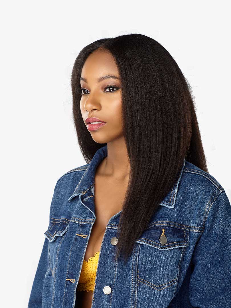 Woman wearing Curls Kinks & Co 1C Clique 16" clip-in hair. Long, dark, kinky-straight style with a middle part.