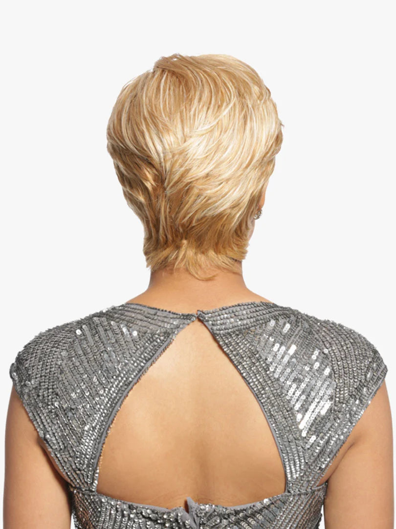 Back view of a person wearing a silver sequined dress with a plain white background