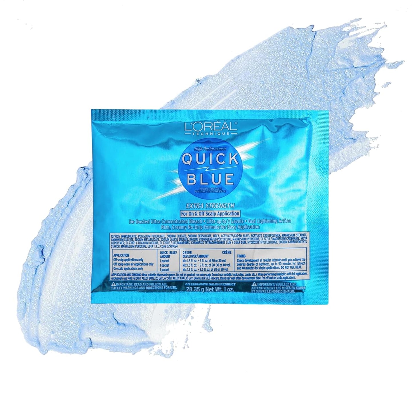 Blue L'Oreal Quick Blue High Performance Powder Bleach 1 oz packet, surrounded by pale blue product residue.