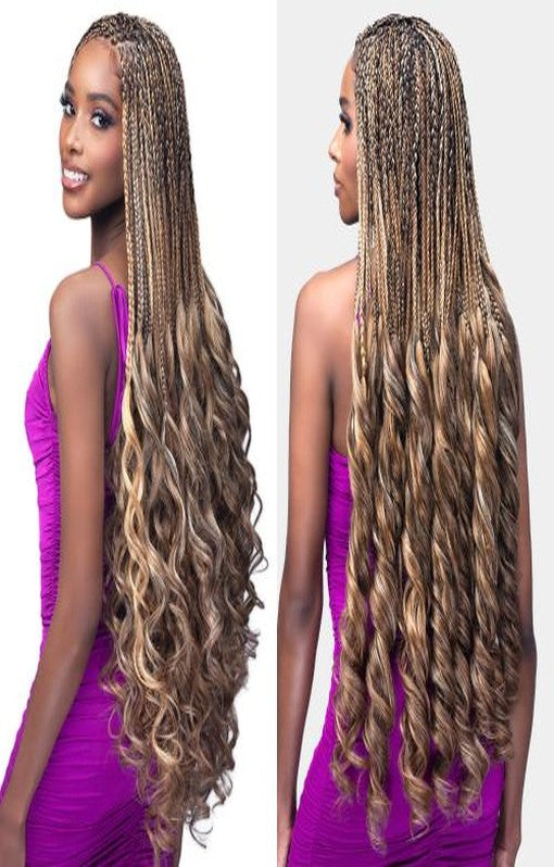 Boss Braid French Curl: Model with long blonde/brown micro braids and big, voluminous curls.