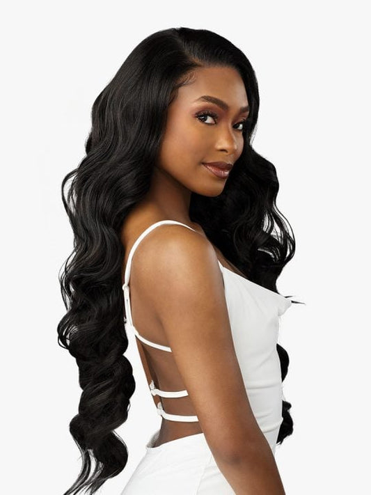 Woman models Bare Lace Full Lace Unit 8, a synthetic lace front wig with very long, black, voluminous waves.