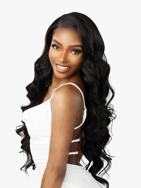 Smiling woman wears Bare Lace Full Lace Unit 8 wig: long, voluminous black waves with a side part.