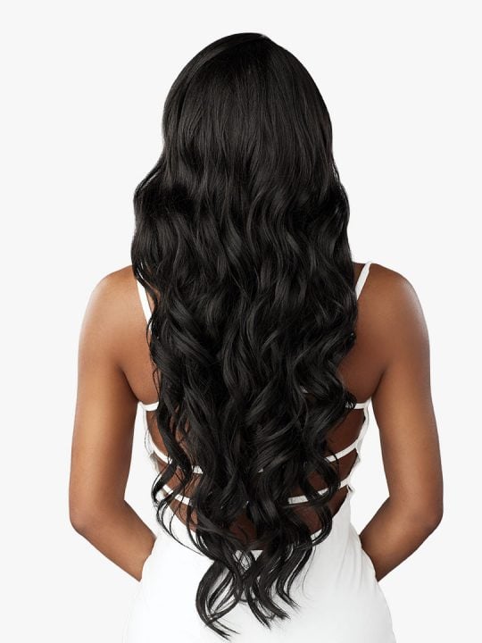 Back view of a person wearing a Bare Lace Full Lace Unit 8 wig, featuring long, black, wavy hair flowing past their waist.
