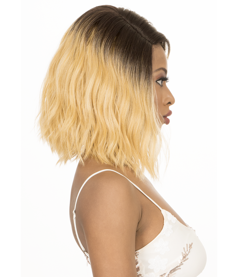 Woman models Cutie 168, a wavy, shoulder-length blonde bob wig with dark brown roots.