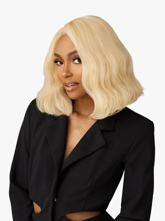 Smiling woman modeling the Butta Chic Bob Lace Wig LOB Unit 4, a wavy platinum blonde long bob with a side part.