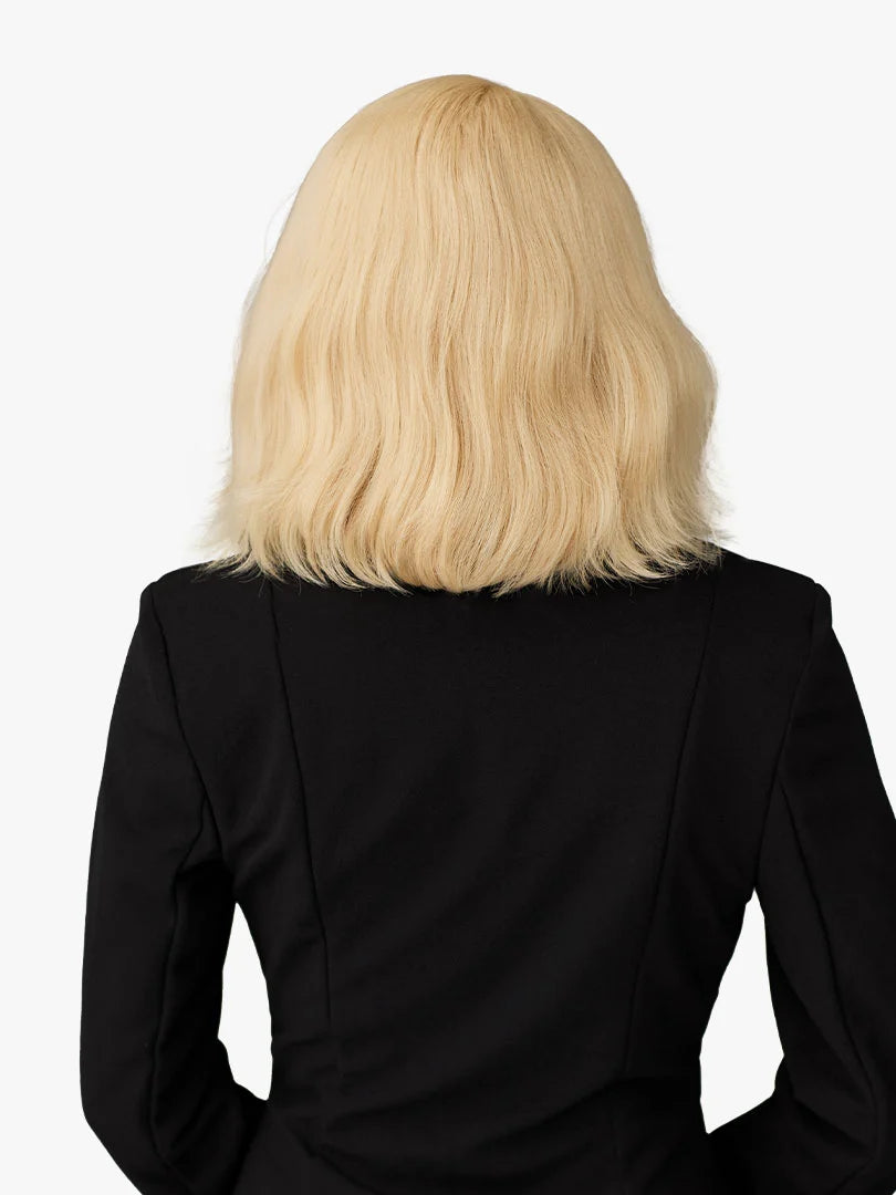 Back view of a person wearing the Butta Chic Bob Lace Wig - LOB Unit 4, a wavy platinum blonde shoulder-length bob.