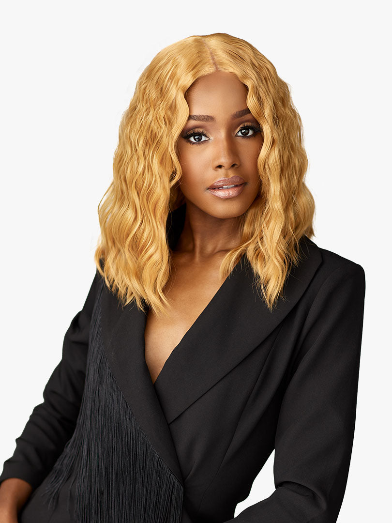 Woman wearing Butta Chic Bob Lace Wig - LOB Unit 6, a wavy, golden blonde, shoulder-length bob.