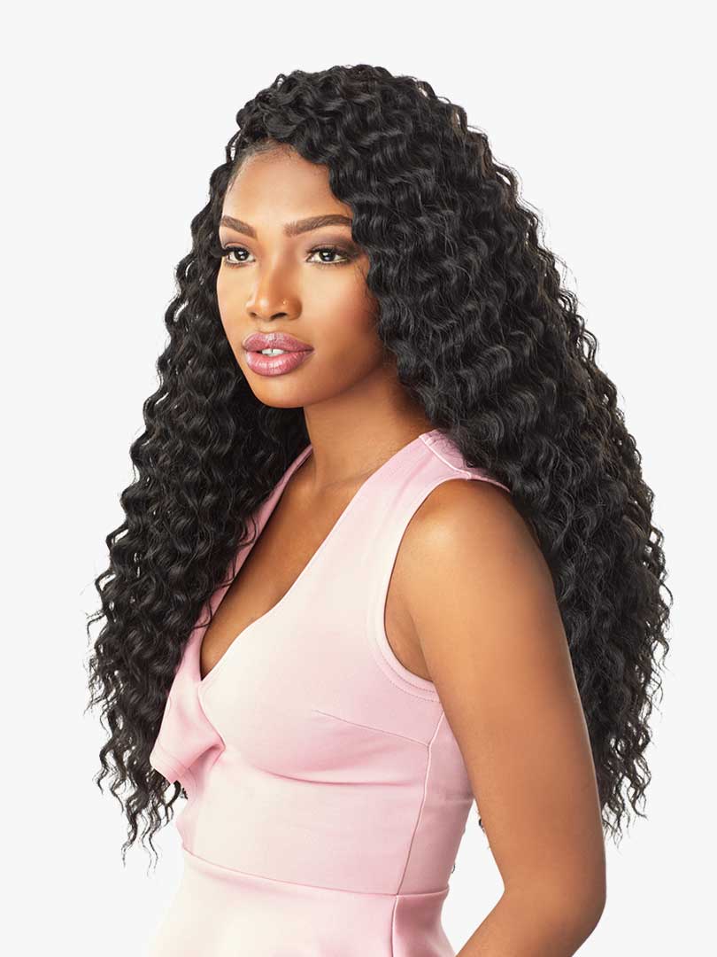 Woman with long, voluminous Lulutress Deep Twist 18" black crochet hair, styled with a side part.