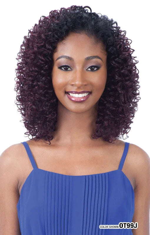 Smiling woman models Freetress Jay Girl Half Wig, featuring voluminous shoulder-length dark burgundy curls with natural ro...