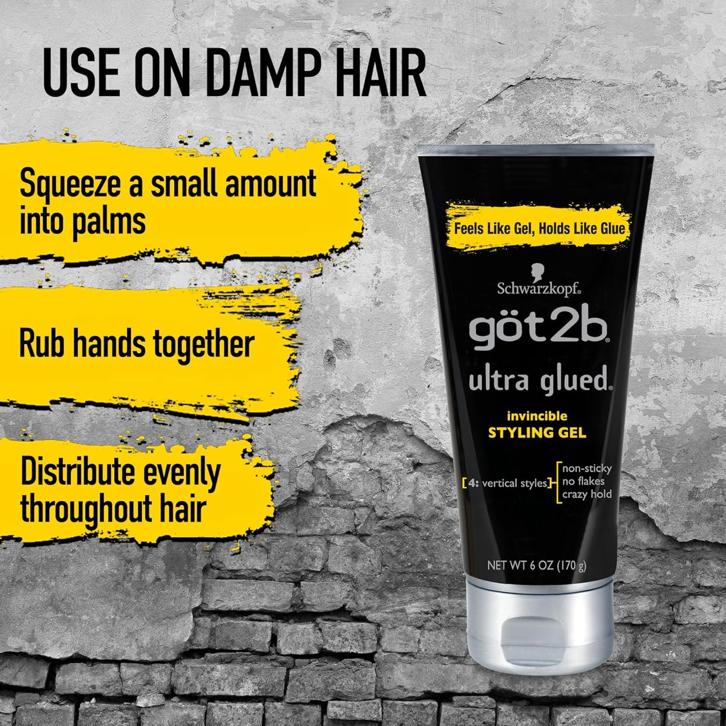 Black tube of Got2b Ultra Glued Invincible Styling Gel with a silver cap, against a concrete background with application t...