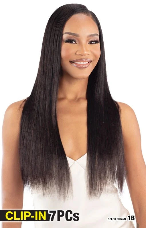 A woman models Shake-N-Go Glossy Straight 18" Clip-In Hair Extensions, featuring long, sleek, dark, straight hair with a s...