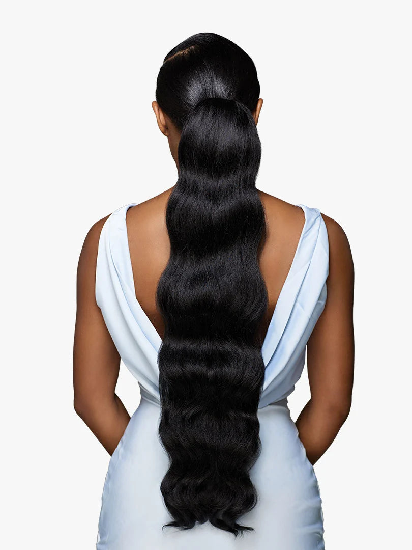 GLAMORA - Glam Updo Unit 6. Woman from behind with a sleek, high black ponytail. Long wavy hair cascades down her back.