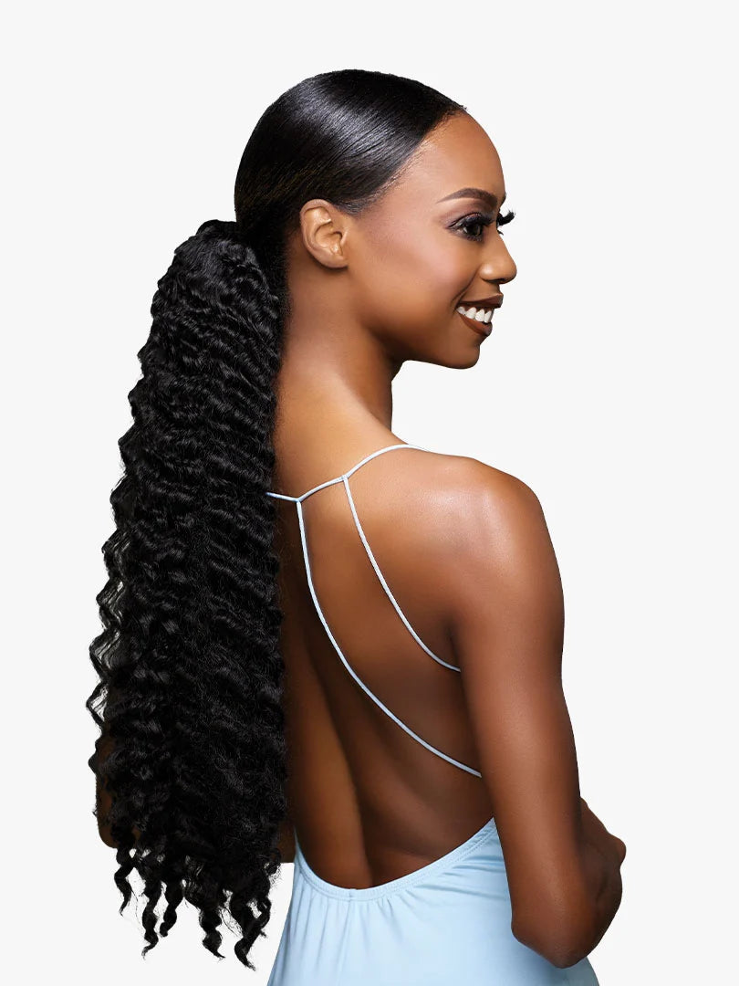 Woman models GLAMORA Glam Updo Unit 7, a sleek high ponytail with long, black, tightly coiled hair flowing down her back.