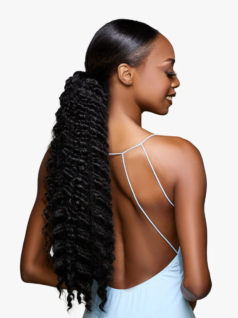 GLAMORA Glam Updo Unit 7: Model with sleek black hair pulled into a long, kinky curly ponytail reaching her waist.