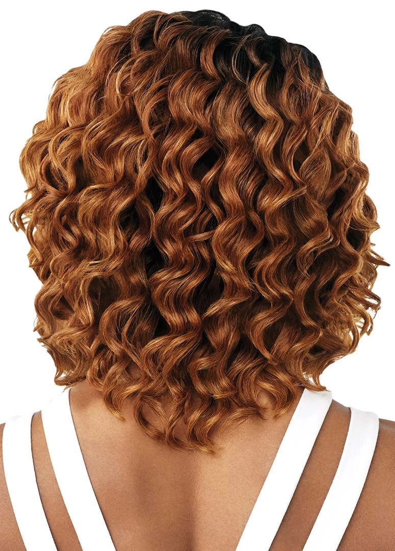 Back view of a person wearing Purple Pack Diva Wave Long hair. It's a shoulder-length, wavy auburn bob with dark roots.