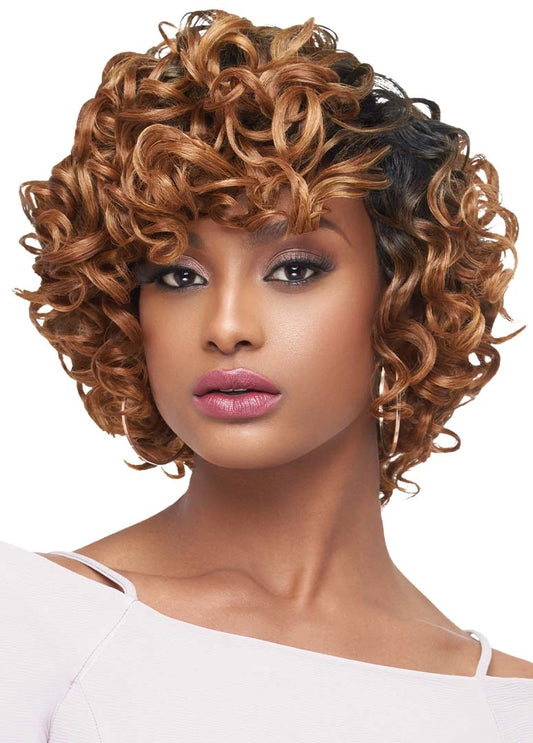 Woman wearing a short, voluminous, honey blonde curly wig from the Purple Pack Large Roller Set.