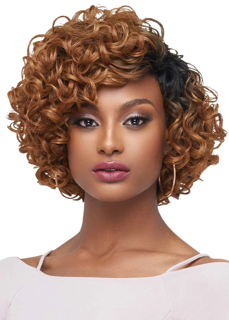 Woman models a short, voluminous, curly ombré wig, dark roots fading to honey blonde. Showcasing Purple Pack Large Roller ...