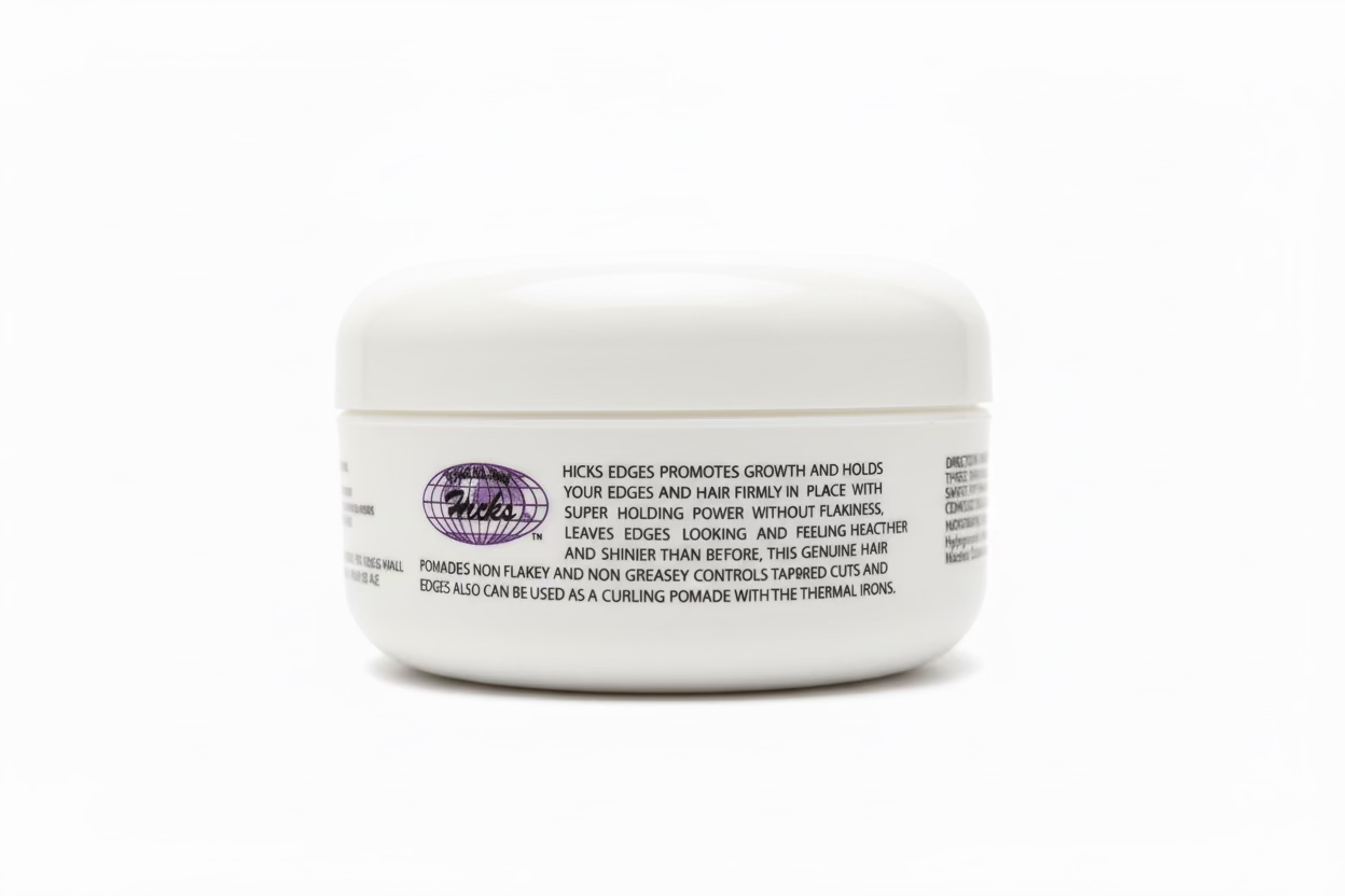 White product packaging for Hicks Total Transformations Edges Styling Pomade. A jar with a purple logo and product info.
