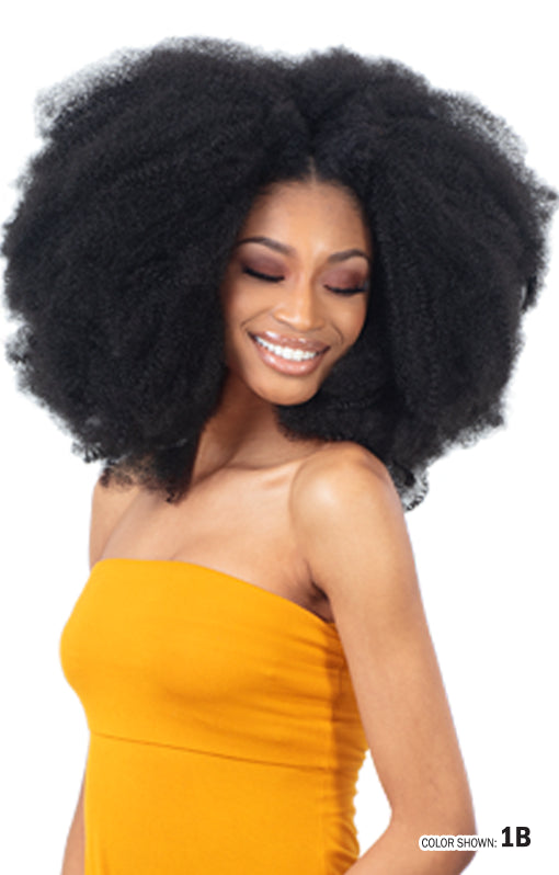Smiling woman models a voluminous, natural black afro style using Freetress 3X Pre-Fluffed Poppin' Twist 16" hair.