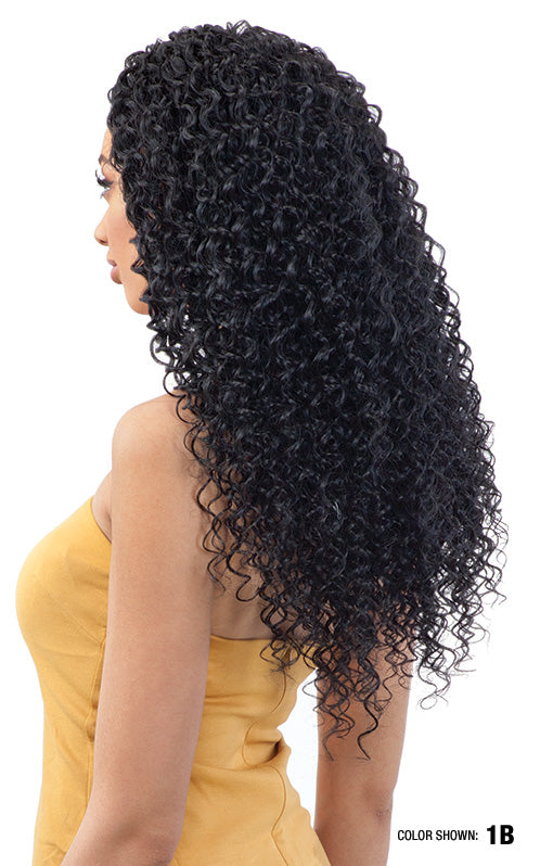 Side view of a person with long, black Organique Water Curl synthetic hair cascading past the waist.