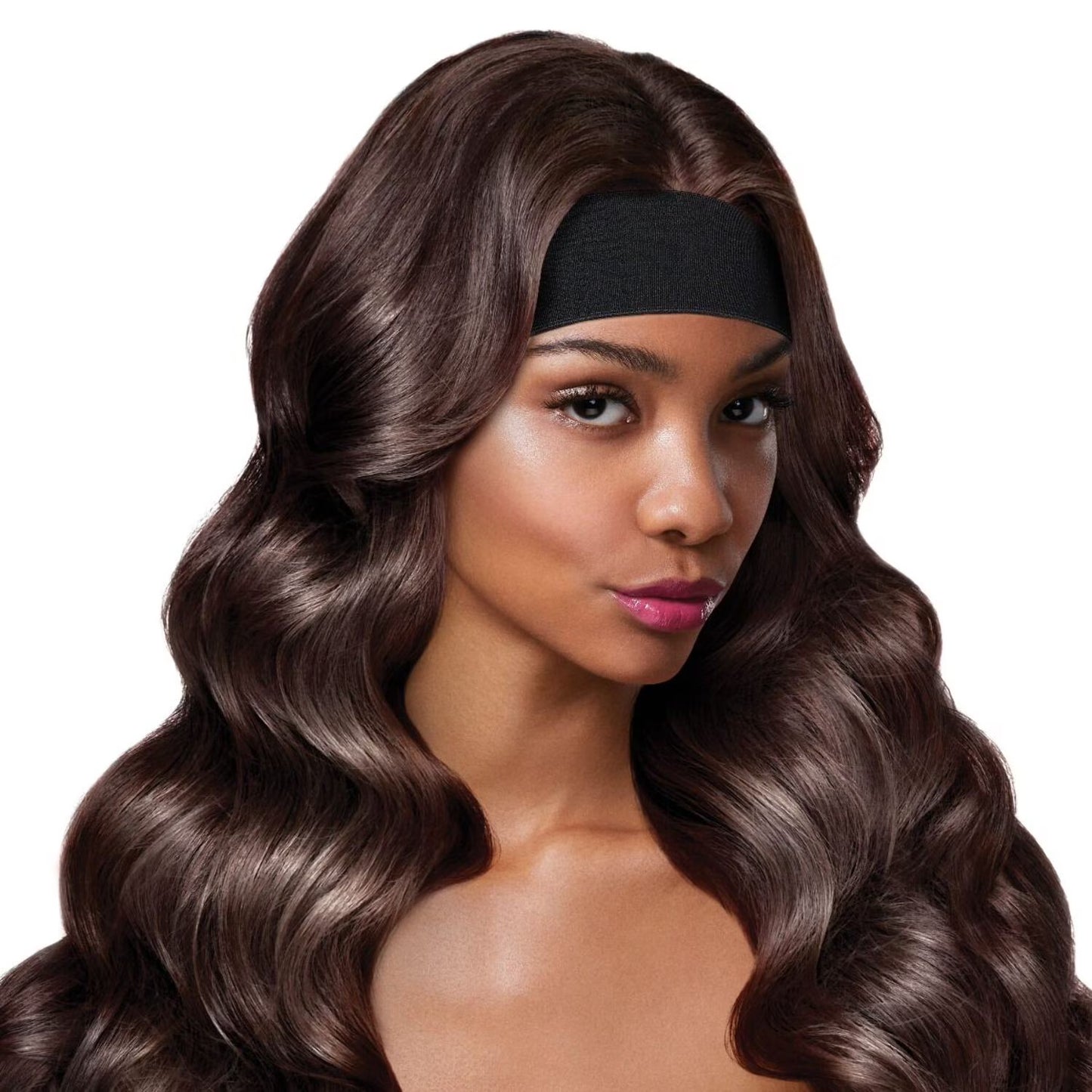 Woman with long, wavy dark brown hair wearing a wide black Red by Kiss Perfect Melt Elastic Wigband.