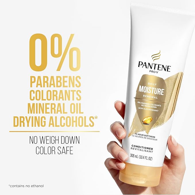 Hand holding Pantene Pro-V Daily Moisture Renewal Conditioner, white tube with gold label. Prominent 0% parabens.