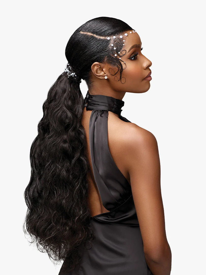 Model wears long, wavy black Pearlish Virgin Remy EURO BODY hair in a high ponytail with elegant pearl-decorated baby hairs.