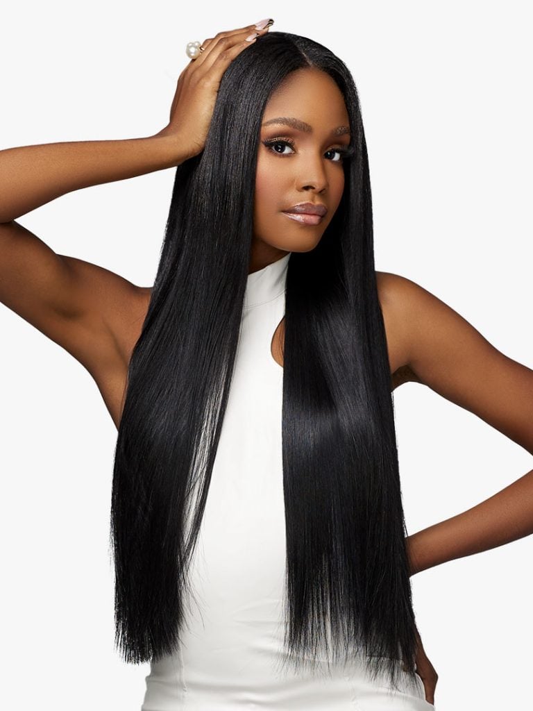 Woman modeling Pearlish Virgin Remy Human Hair. She has long, sleek, straight black hair with a center part.