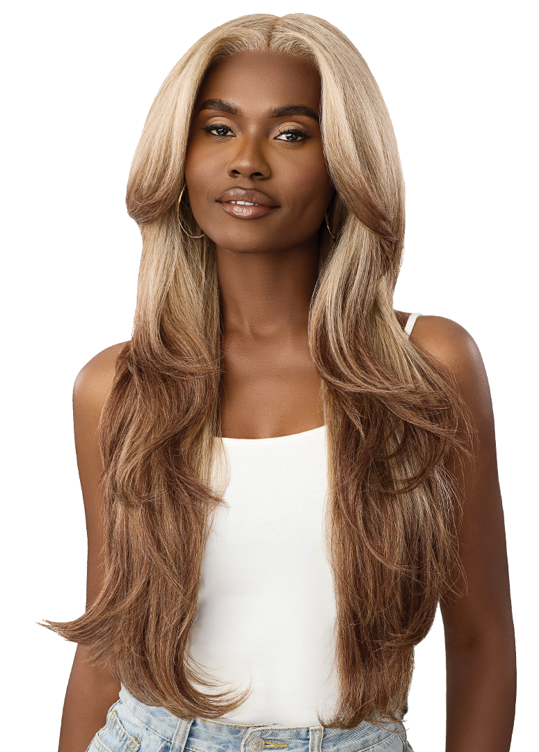 Smiling woman models Perfect Hair Line HD Lace Front Wig OnVybes 9. Long, layered, wavy blonde-to-brown ombre, deep side p...