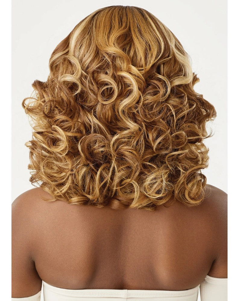 Back view of a person wearing Glueless HD Lace Front Wig 16" RITA, with voluminous blonde curly hair.