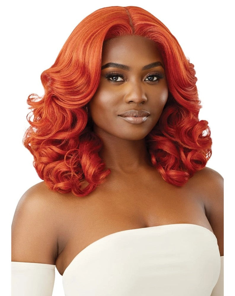 Woman wearing Glueless HD Lace Front Wig 16" RITA, a bright orange, shoulder-length wavy bob with a natural part.
