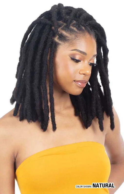 A woman models medium-short, natural black Ibiza 100% Human Hair Locs, styled with zigzag parting.