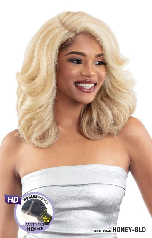 Smiling woman wearing Snatched JOVIE Glueless HD Lace Wig. Shoulder-length honey blonde wig with voluminous waves.