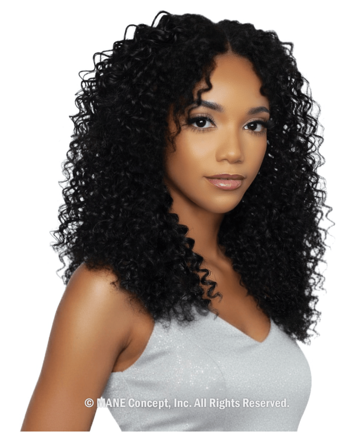 Woman wears Pristine Micro Crochet 14" Water Wave human hair. Her black, voluminous curls fall past her shoulders.