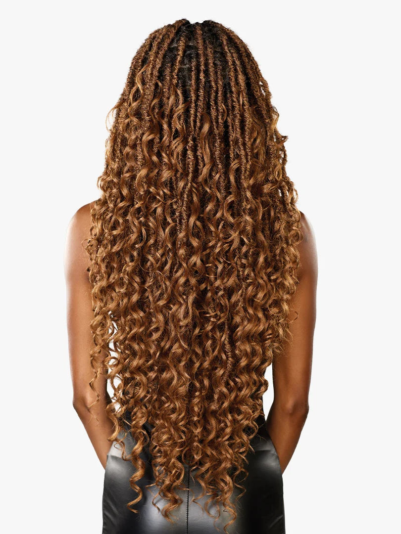 Rear view of a person with long, curly STRAND X Glueless Lace Wig Unit 4. It features layered auburn goddess locs with dar...