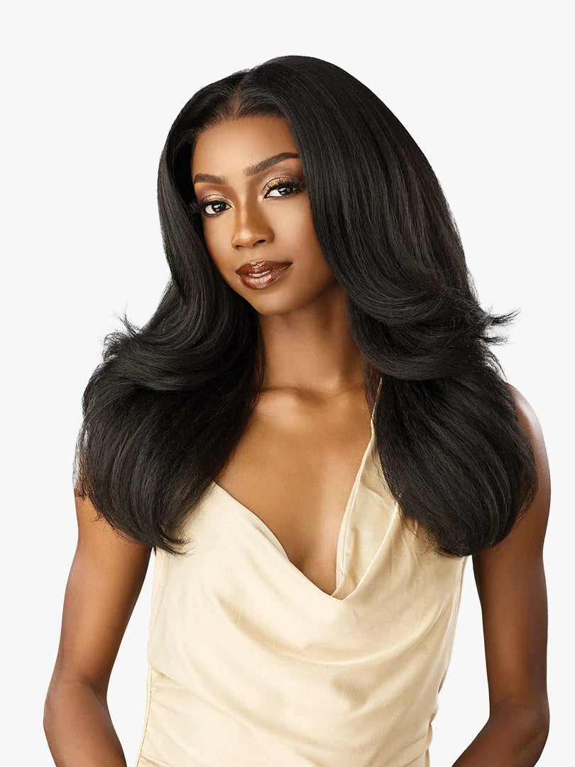 Model wears Cloud 9 What Lace? Evadra wig: long, voluminous black hair, layered with a center part.