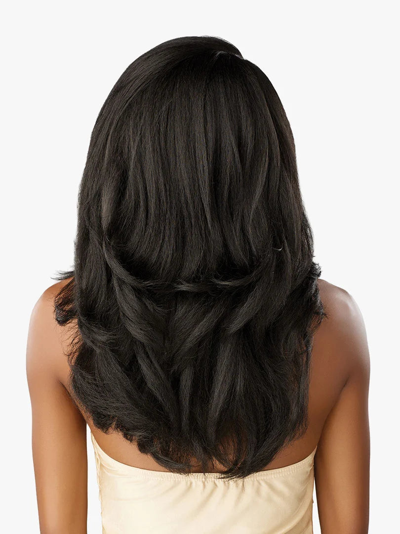 Back view of person in Cloud 9 What Lace? Evadra wig, long layered black hair with bouncy texture.